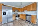 Kitchen with stainless steel appliances and wood cabinets at 770 Berkley Dr, Fortville, IN 46040