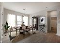 Contemporary dining room featuring an oval table, stylish chairs, and elegant decor at 19826 Chatham Shore Ln, Westfield, IN 46074