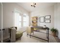 Bright home office with modern desk, chair, shelving and natural light at 19826 Chatham Shore Ln, Westfield, IN 46074