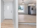 Inviting entryway featuring new floors, a stylish front door, and views into an open-concept living space at 2209 Thornewood Dr, Anderson, IN 46012