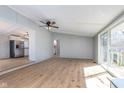 Open-concept living area with sleek floors, light gray walls, and seamless transitions to the kitchen at 2209 Thornewood Dr, Anderson, IN 46012