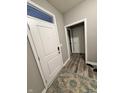 Welcoming entryway featuring wood-look floors, neutral walls, and a bright white front door for a modern aesthetic at 253 Darrough Dr, Greenwood, IN 46143