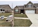 Inviting home exterior with a well-kept lawn and 