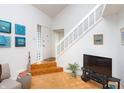 Inviting foyer with hardwood floors, high ceilings and decoratively painted walls at 2563 Hideaway S Dr, Indianapolis, IN 46268