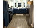 Well-lit kitchen featuring updated appliances and plenty of counter space at 2650 W State Road 252, Flat Rock, IN 47234