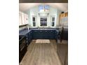 Modern kitchen featuring updated appliances, including a stainless steel refrigerator at 2650 W State Road 252, Flat Rock, IN 47234