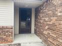 Close-up of a brick home's entrance, showcasing a well-maintained front door at 3330 Corey Dr, Indianapolis, IN 46227