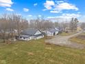 Aerial view of a well-maintained home with sprawling lawn and charming patio set at 4131 N County Road 500 E, Danville, IN 46122