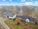 Aerial view of home featuring an outdoor playground, trampoline, and covered porch at 4131 N County Road 500 E, Danville, IN 46122