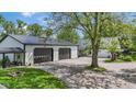 Spacious three-car garage with black doors and ample driveway parking at 4131 N County Road 500 E, Danville, IN 46122