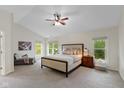 Spacious main bedroom with large windows and a comfortable seating area at 5208 Clear Lake Ct, Carmel, IN 46033