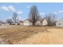Charming single-story home with attached garage and well-maintained front lawn at 5320 Milhouse Rd, Indianapolis, IN 46221