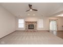 Spacious living room with fireplace and sliding door leading to the screened in porch at 5320 Milhouse Rd, Indianapolis, IN 46221