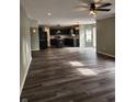 A view of the open floor plan which features a kitchen, dining area and a large seating area at 5731 W Woodview Trl, McCordsville, IN 46055