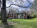 Beautiful home with a well-maintained lawn, adorned with a charming tree swing at 6632 Sargent Rd, Indianapolis, IN 46256