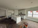 Bright, spacious kitchen with a large center island, stainless steel sink, and white cabinets at 840 Arkansas Ct, Westfield, IN 46074