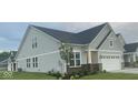 Attractive two-story home with gray siding, well-maintained landscaping, and attached two car garage at 9101 S Stone Trace S Blvd, Avon, IN 46123