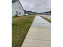 Neighborhood street with sidewalks and well-maintained lawns in a peaceful residential community at 9101 S Stone Trace S Blvd, Avon, IN 46123