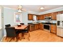 Traditional kitchen boasts wooden cabinetry, stainless steel appliances, and a cozy breakfast nook at 11710 E 75Th St, Indianapolis, IN 46236
