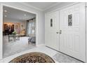 Welcoming foyer with tile flooring, double doors and a glimpse into the living area at 295 Camden Dr, Zionsville, IN 46077