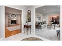 Inviting foyer with views into the living room with fireplace, as well as the dining room at 295 Camden Dr, Zionsville, IN 46077