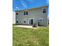 Spacious backyard features a well-maintained lawn and concrete patio, great for outdoor entertaining at 3416 Firethorn Dr, Whitestown, IN 46075