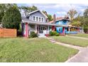 Charming two-story home featuring a covered porch and a well-maintained lawn at 726 E 33Rd St, Indianapolis, IN 46205