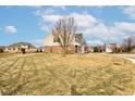 Expansive lot with a view of the home's side, showcasing the lawn and neighborhood at 8218 Elsen Ridge, Avon, IN 46123