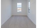 Neutral bedroom featuring carpeted floors and two bright windows at 9345 Anthem Ave, Plainfield, IN 46168