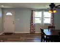 Dining area features wood flooring, a ceiling fan, and a window at 1435 E New Rd, Greenfield, IN 46140