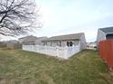 Private backyard featuring a classic white picket fence at 1629 Jaques Dr, Lebanon, IN 46052