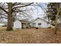 Backyard featuring a patio and a spacious lawn perfect for outdoor activities at 3000 Pearl St, Anderson, IN 46016