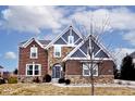 Charming two-story home with a combination of brick and stone exterior, surrounded by a well-maintained lawn at 3258 Cherokee Cir, Bargersville, IN 46106