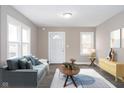 Inviting living room with contemporary furniture, neutral walls, and bright natural light at 354 W 38Th St, Anderson, IN 46013