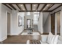 Spacious foyer featuring a staircase, wood floors, and an elegant entry table, creating a welcoming atmosphere at 4135 Hamilton Run, Zionsville, IN 46077