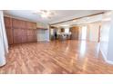 Bright, open-concept living room with wood-look flooring, ideal for entertaining guests at 6602 S 400 W, Columbus, IN 47201