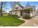 Charming home with a front porch swing, walkway, and a well-manicured lawn at 800 N 400 W, Bargersville, IN 46106