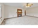Cozy living room with plush carpet, fireplace, and a ceiling fan at 800 N 400 W, Bargersville, IN 46106