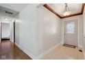 Bright foyer with tile flooring, wood trim ceiling detail and view of the home's entry door at 901 Detroit St, Beech Grove, IN 46107