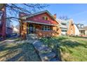 Charming brick home with a well-maintained lawn and inviting front porch at 916 N Audubon Rd, Indianapolis, IN 46219