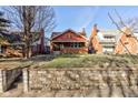 Charming brick home with a well-maintained lawn and inviting front porch at 916 N Audubon Rd, Indianapolis, IN 46219