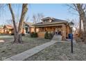 Charming brick home featuring a classic craftsman style with a well-manicured lawn at 929 N Audubon Rd, Indianapolis, IN 46219