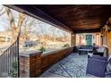 Inviting front porch with comfortable seating area overlooking the neighborhood at 929 N Audubon Rd, Indianapolis, IN 46219