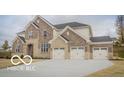 Beautiful two-story home boasting stone and brick, complete with a three-car garage at 9658 Farragut, Indianapolis, IN 46256