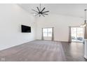 Open-concept living space features high ceilings, ample natural light, and vinyl plank flooring at 1438 Willow Tree Ln, Sheridan, IN 46069