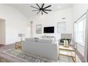 Inviting living room with vaulted ceilings, neutral decor, and stylish furnishings and a ceiling fan at 1438 Willow Tree Ln, Sheridan, IN 46069