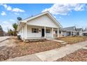 Cozy one-story house with a welcoming front porch and convenient sidewalk access at 1533 Castle Ave, Indianapolis, IN 46227