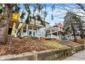Picturesque home featuring a cozy front porch, traditional architectural details, and charming curb appeal at 342 N Arsenal Ave, Indianapolis, IN 46201