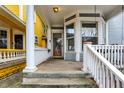 Charming front porch featuring a cozy seating area, classic architectural elements, and an inviting entrance at 342 N Arsenal Ave, Indianapolis, IN 46201