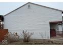 Photo of the side of home showing the exterior with wood fence at 4050 Harmony Dr, Indianapolis, IN 46221